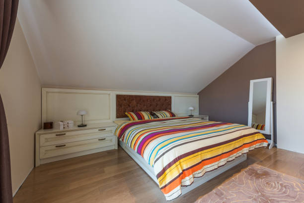 istock Big bedroom in attic apartment 639533692