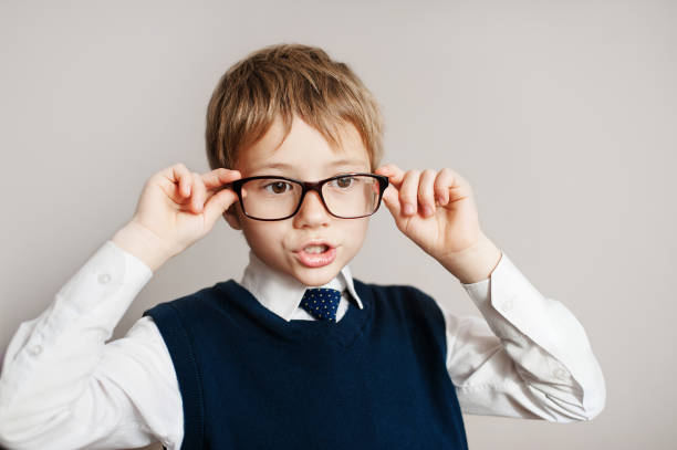 istock Surprised smart boy in big glasses staring at the camera 639534356