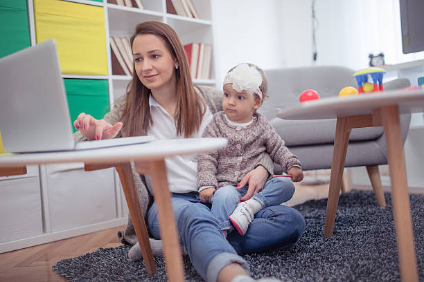 istock Mother working with her baby 639534716