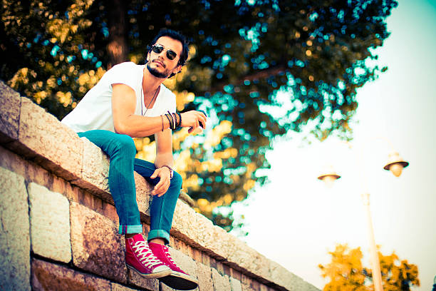 hipster drinking coffee in the street and resting
