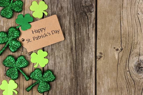 istock St Patricks Day tag with shramrock side border over wood 639536644