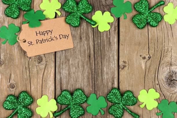 istock St Patricks Day tag with shramrock double border over wood 639536698
