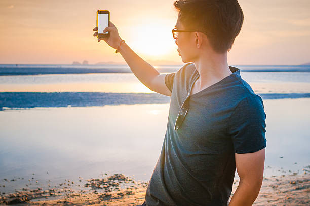 istock Man enjoy with sunset and tropical beach background 639537240