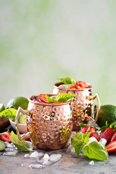 istock Moscow mule cocktail with lime and strawberry 639539078