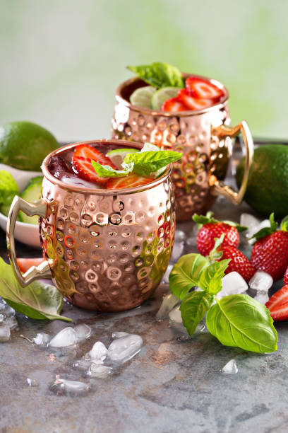 istock Moscow mule cocktail with lime and strawberry 639539110