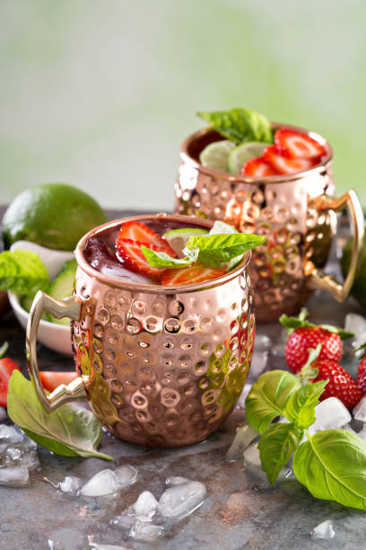 istock Moscow mule cocktail with lime and strawberry 639539138