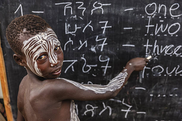 istock African young boy is learning  English language, Karo tribe 639540198