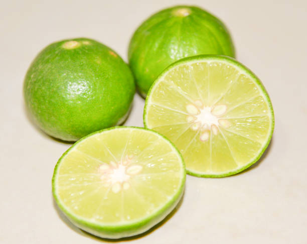 istock composite with Green lime isolated on white background 639542438