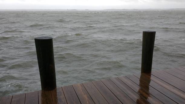 istock wooden dock on rainy overcast day 639545350