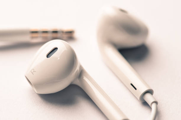 istock Earphones white color macro shot vintage filter 639546278