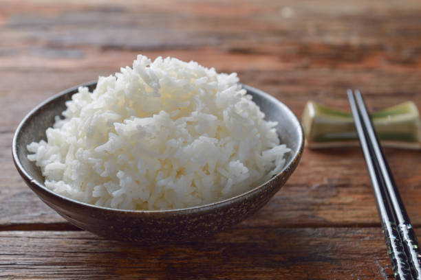 istock Bowl of Organic White Rice with chop sticks 639549646