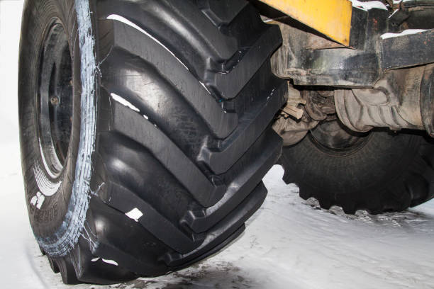istock tractor stands on the snow 639551230