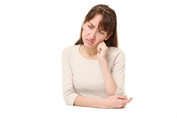 istock young woman worries about something 639551386