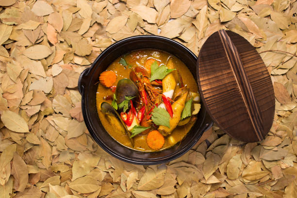 istock Seafood coconut milk soup with red chilli, and tomato 639552882