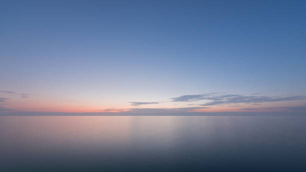 istock Beautiful sunset with blue sea and sky peaceful background 639553330