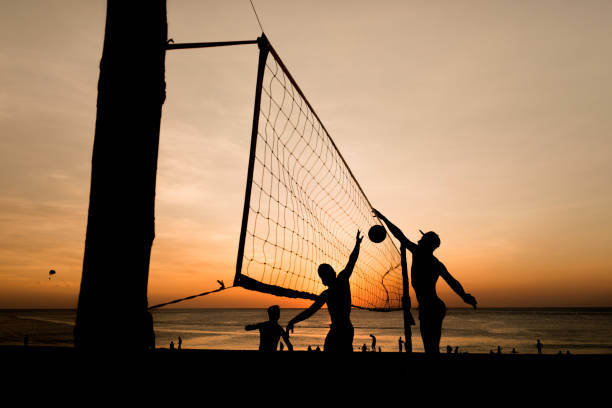 istock Beach volleyball silhouette at sunset , motion blurred 639553948