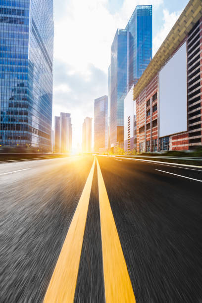 istock urban traffic road with cityscape 639555712