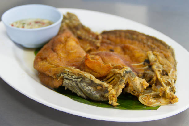 istock Snapper topped with sauce 639555766