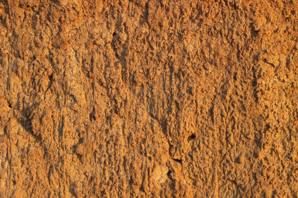 istock Cliff of the brown orange clay. Texture for background 639558080