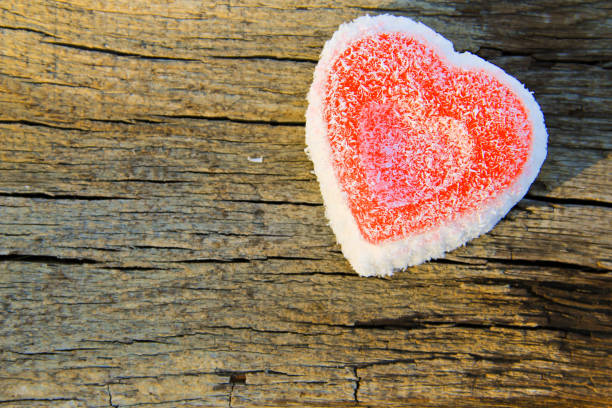 istock Heart shaped cake on wooden background 639558164