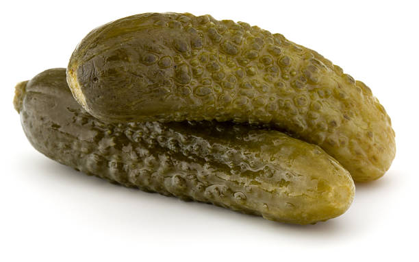 istock pickled or marinated  cucumbers isolated on white background 639561596