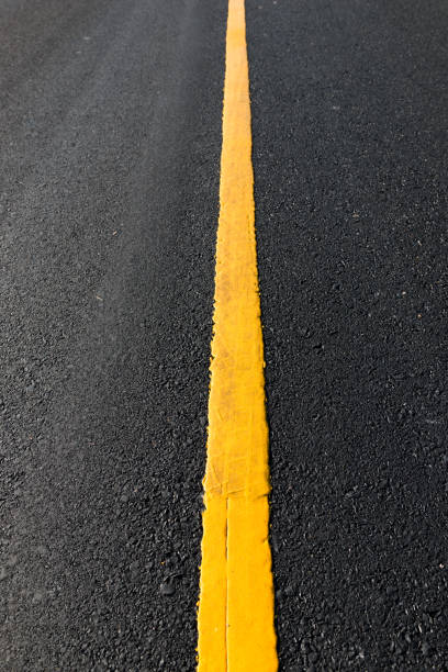 istock Yellow line on the new road 639562494
