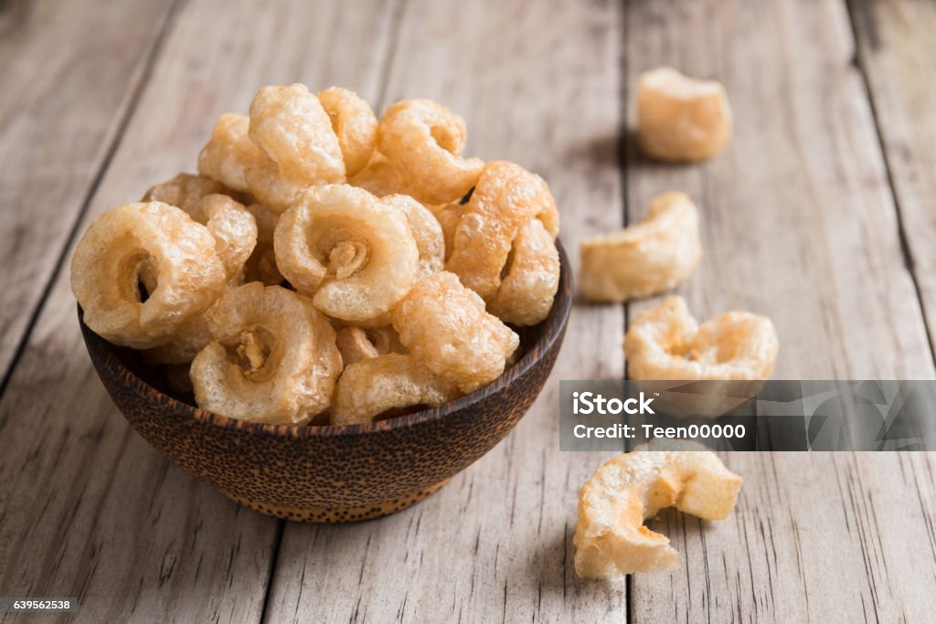 Pork rinds also known as chicharon or chicharrones Pork rinds also known as chicharon or chicharrones, deep fried pork skin Adulation Stock Photo