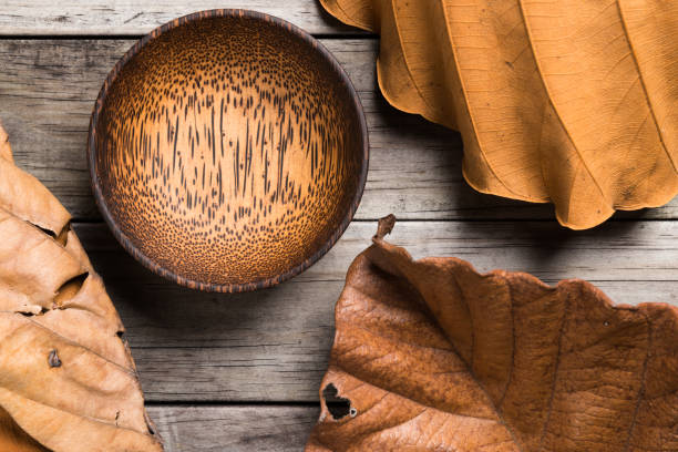 istock Empty Wooden Bamboo Bowl isolated on wood Background 639563242