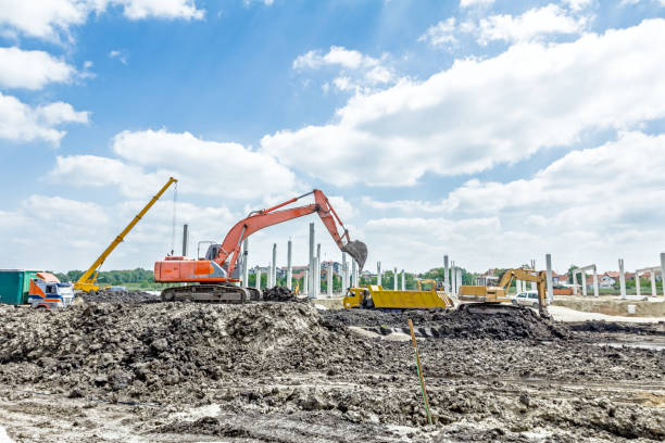 istock Excavator is loading a truck on building site 639563614