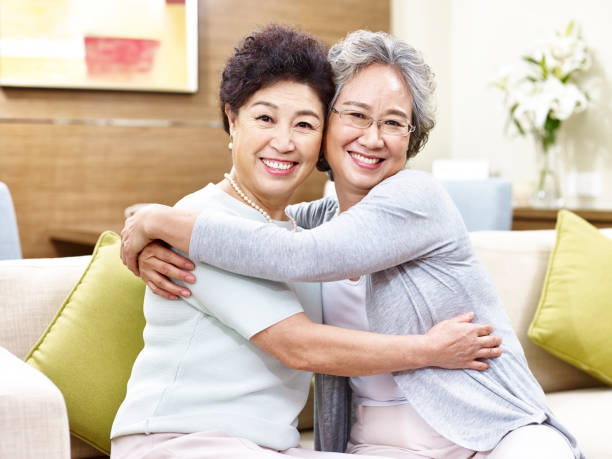 istock senior asian women hugging each other 639563836