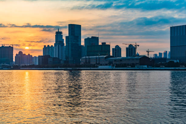 istock City Skyline By River Against cloudy Sky 639563888