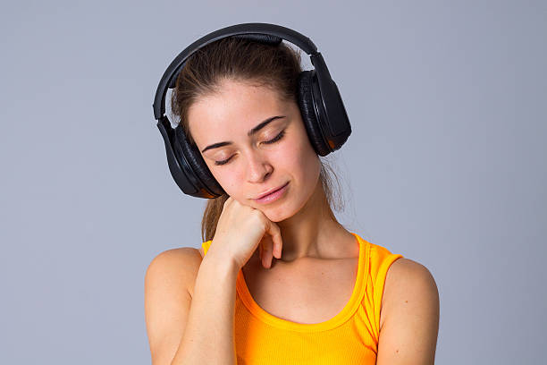 istock Young woman in headphones 639564864
