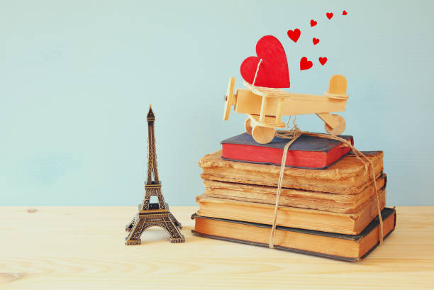 istock Wooden plane with heart next to Eiffel Tower 639565106