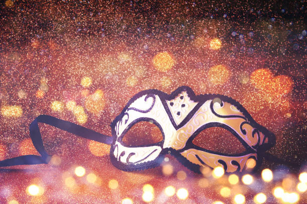 istock elegant venetian mask on gold glitter background 639568874