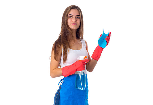 istock Woman holding duster and detergent 639570580