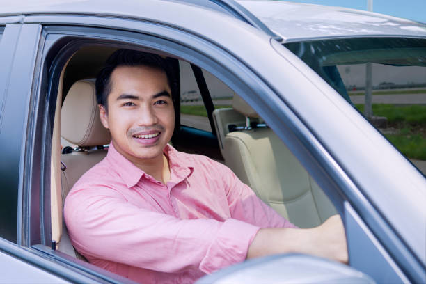 istock Young businessman driving car 639571648