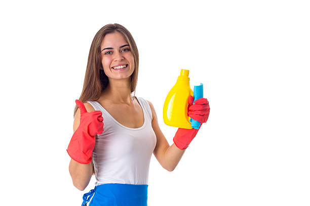 istock Woman holding duster and detergent 639571866