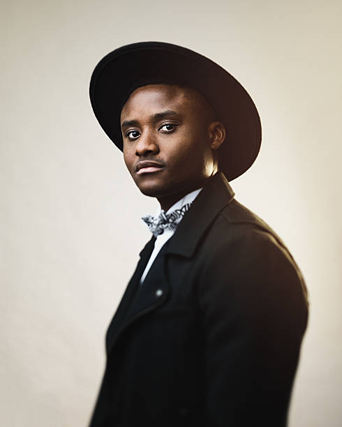 istock Serious man wearing black suit and hat 639572218