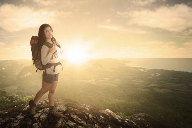 istock Woman standing and posing with sunlight 639572288