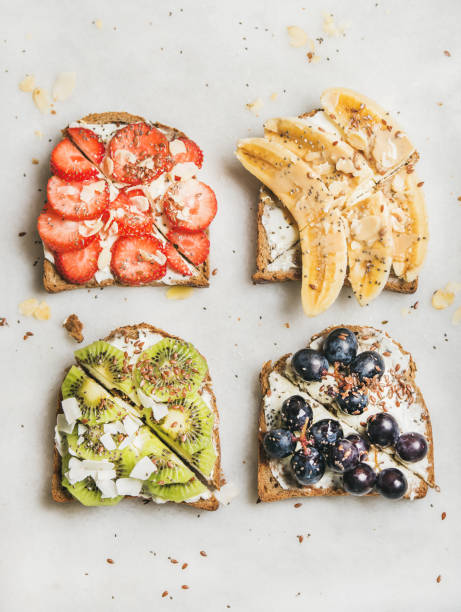 istock Healthy breakfast toasts with fruit, nuts and cream cheese 639572788
