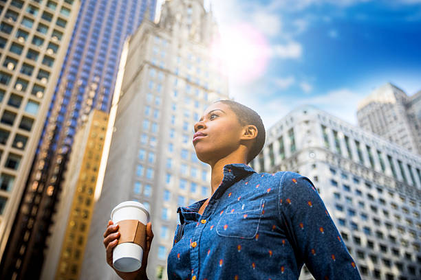 istock Woman having a break in city downtown drinking a coffee 639572902