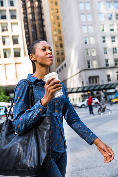 istock Woman having a break in city downtown drinking a coffee 639573164