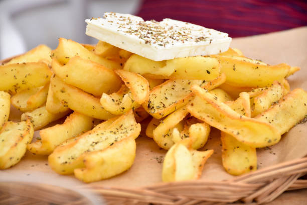 istock Baked potatoes with savory and cheese on top 639573782