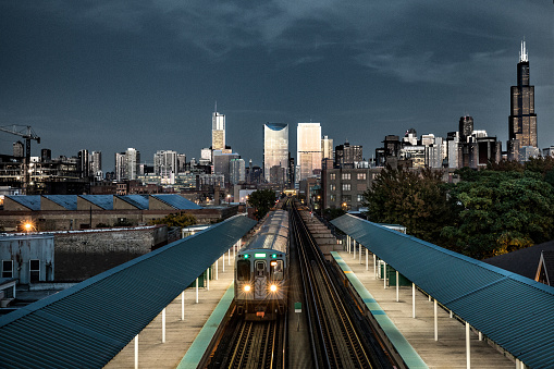 Subway train - Transportation in Chicago, IL. The city is visible on the background