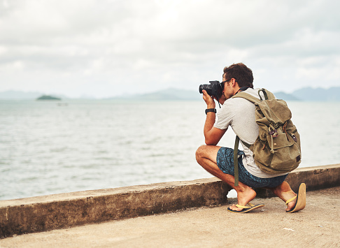 Shot of a young man out with his camera