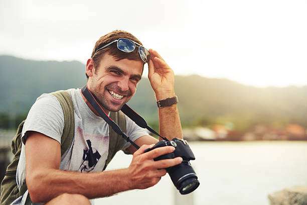 Shot of a young man out with his camera