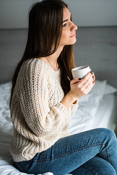 istock Young girl drink coffee in her bed 639578614