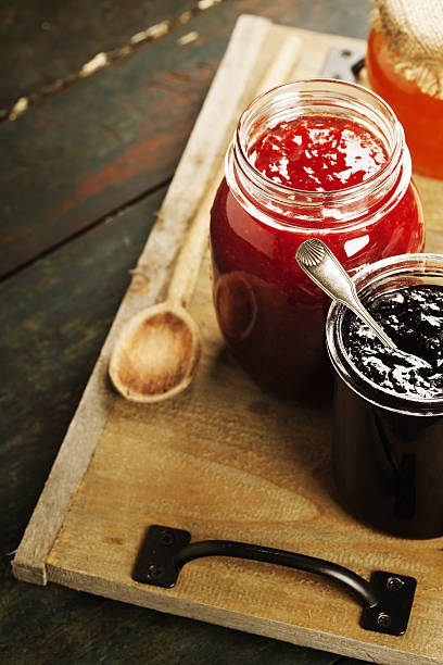 istock Fruit and berry jam on a wooden background 639578870