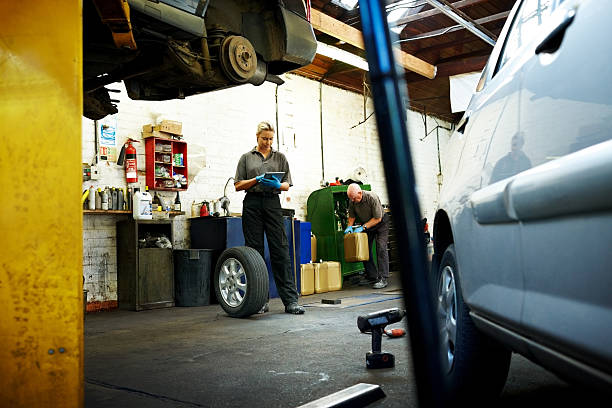 istock Female working in auto repair shop 639580920