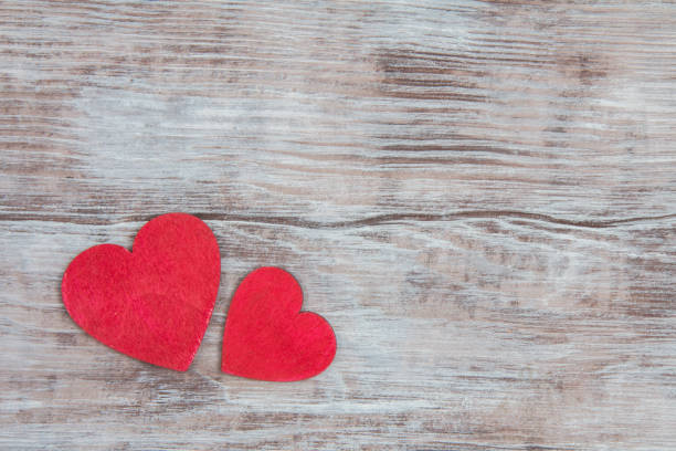 istock Two red wooden heart on gray rustic table. Valentines Day 639581748